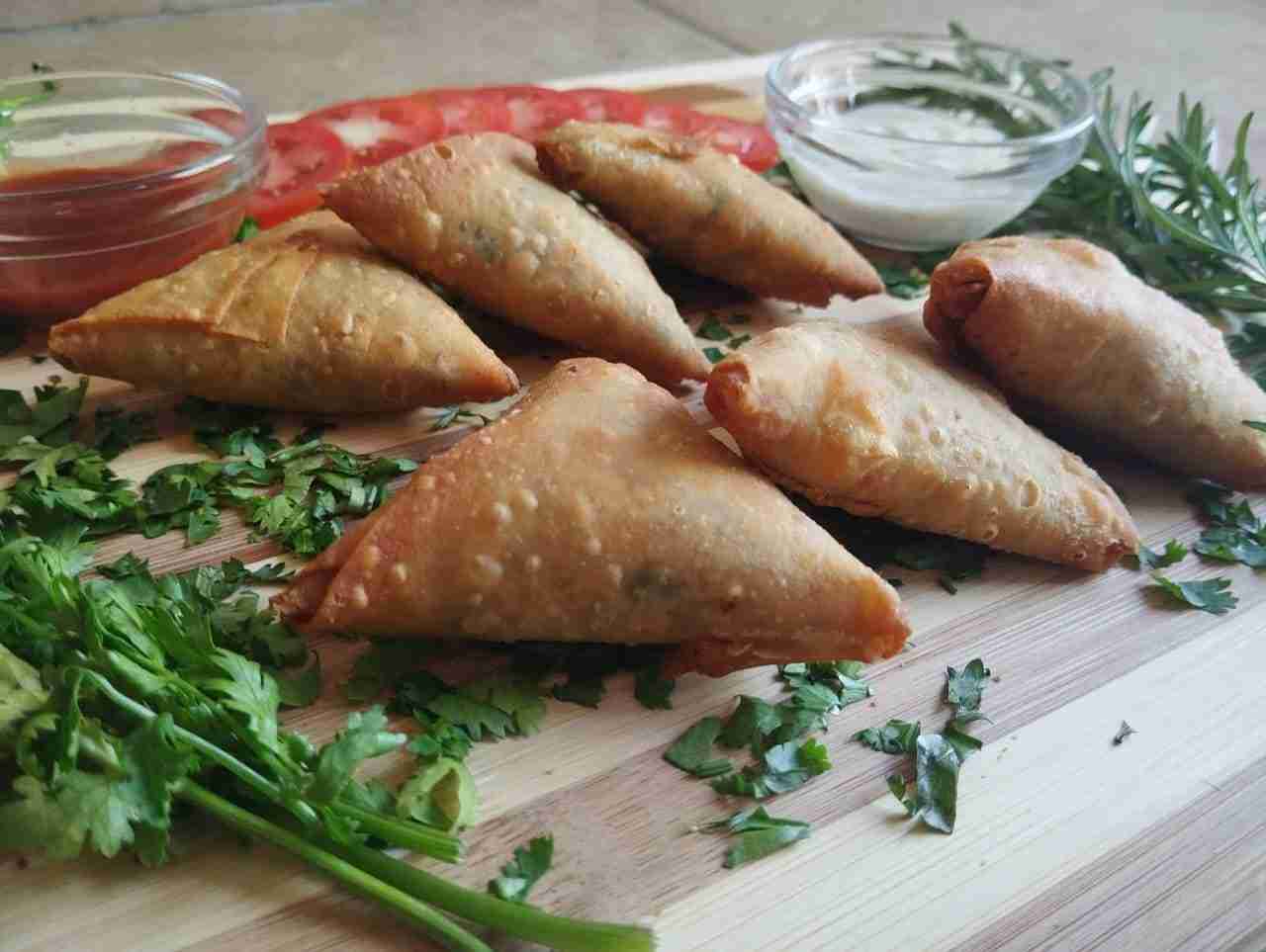 Frozen half fried fish samosas 